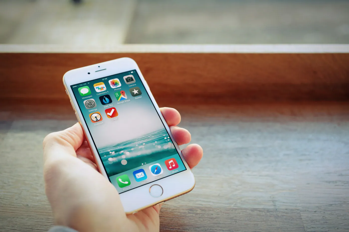 Student holding a smartphone with useful apps
