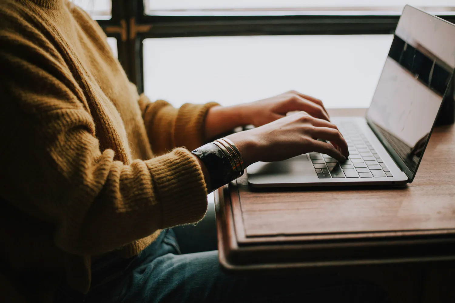 Student using a laptop for a live counselling session